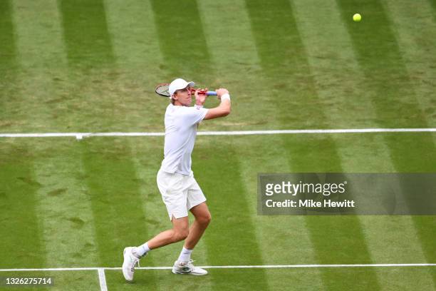Kevin Anderson of South Africa looks to play a backhand in his Men's Singles Second Round match against Novak Djokovic of Serbia during Day Three of...