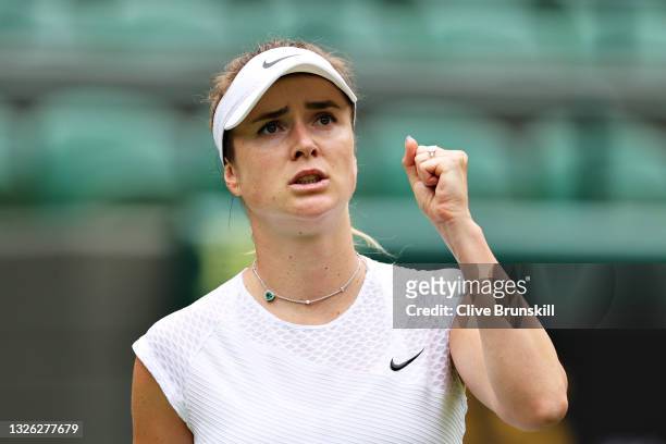 Elina Svitolina of Ukraine celebrates a point in her Ladies' Singles First Round match against Alison Van Uytvanck of Belgium during Day Three of The...