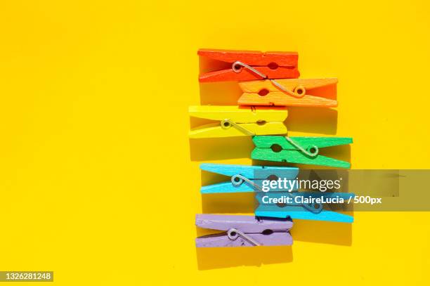 mood-boosting color concept,multi-colored wooden multi-colored rainbow - clothes peg stock-fotos und bilder