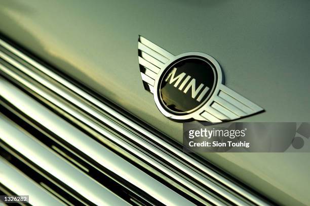 The Mini logos marks the hood of a new Mini Cooper car June, 25 2001 in London, England as the new model is unveiled to the auto industry press. The...