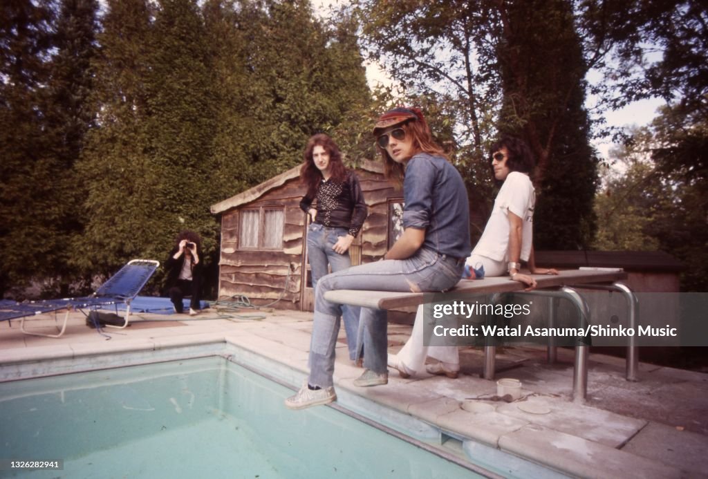 Queen Ridge Farm Queen group portrait by a swimming pool at Ridge Farm Studio during ...
