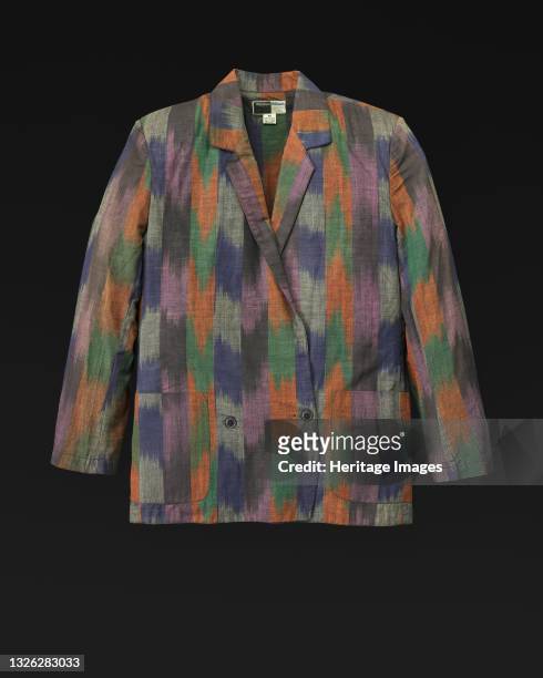 Colorful block striped jacket designed by Willi Smith for WilliWear Limited. A. The long sleeve jacket has a v-neck and a notched lapel collar. There...