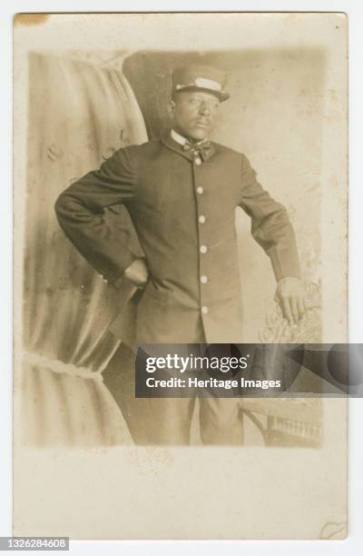 Black-and-white photographic postcard that was never stamped and mailed but has written in pencil on the back the name 'T.R. Joseph'. The image on...