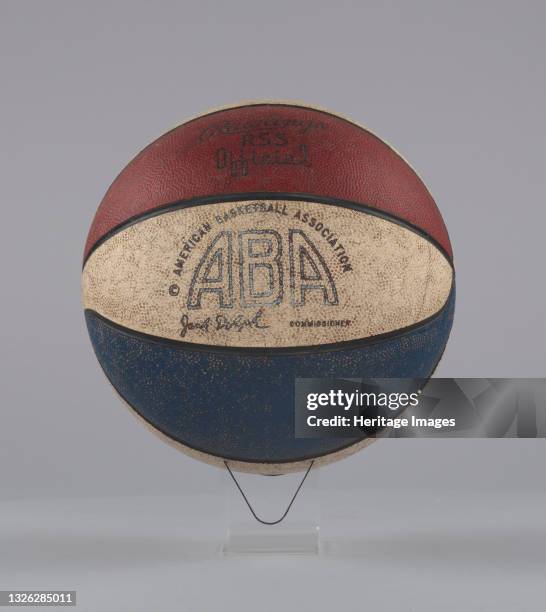 An ABA game-used red, white and blue basketball manufactured by Rawlings. On one of the white sections is printed in black [AMERICAN BASKETBALL...