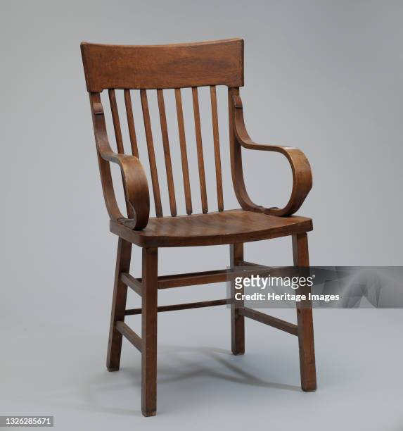 Bentwood armchair purportedly belonging to a black church in Tulsa that was looted during the Tulsa Race Massacre of 1921. The chair has curved arm...