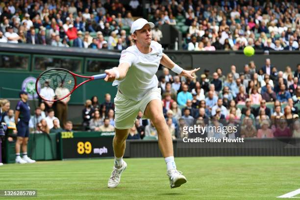 Kevin Anderson of South Africa stretches to play a forehand in his Men's Singles Second Round match against Novak Djokovic of Serbia during Day Three...