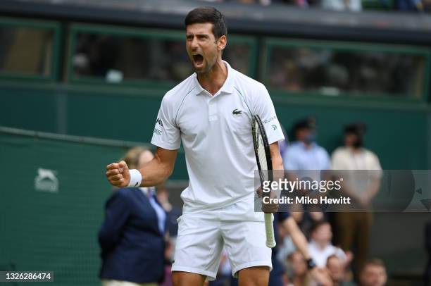 Novak Djokovic of Serbia celebrates in his Men's Singles Second Round match against Kevin Anderson of South Africa during Day Three of The...