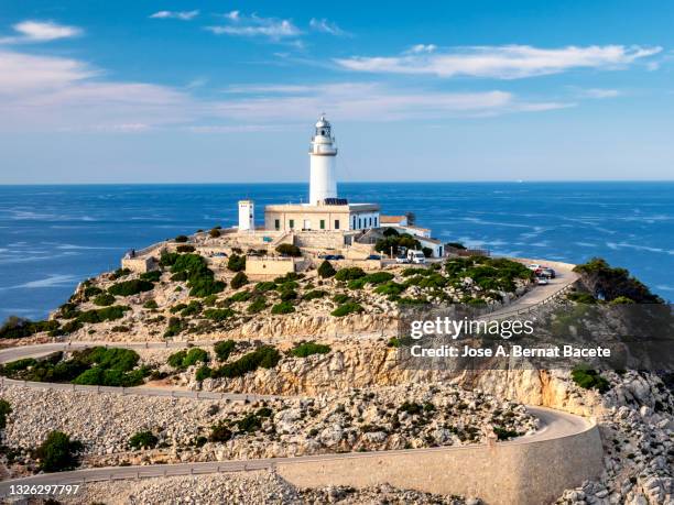 elevated view of the access road to the formentor lighthouse on the island of mallorca. - cabo formentor stock pictures, royalty-free photos & images