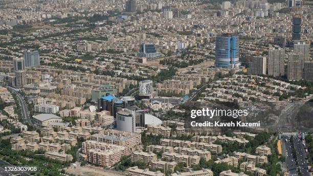 An elevated view of residential buildings in Gharb City also known as Ghods City seen from one of the upper decks of Milad Tower on June 20, 2021 in...