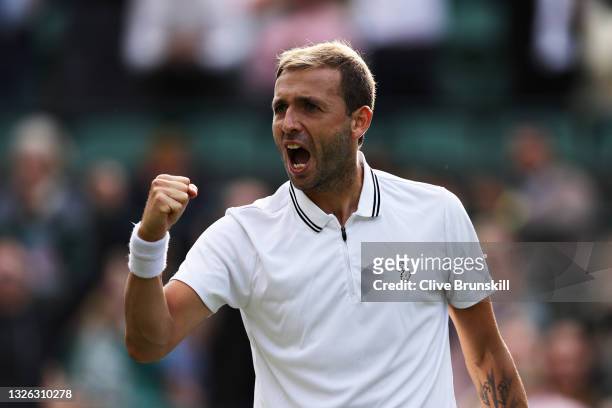 Daniel Evans of Great Britain celebrates match point in his Men's Singles Second Round match against Dusan Lajovic of Serbia during Day Three of The...