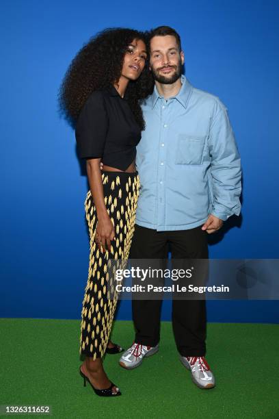 Tina Kunakey and Simon Porte Jacquemus attend the photocall after the Jacquemus "La Montagne" show at La Cite Du Cinema on June 30, 2021 in...