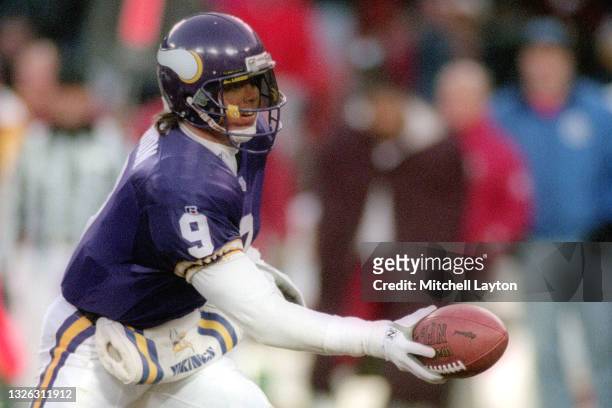 Jim McMahon of the Minnesota Vikings hands off the ball during a NFL football game against the Washington Redskins on December 31, 1993 at RFK...