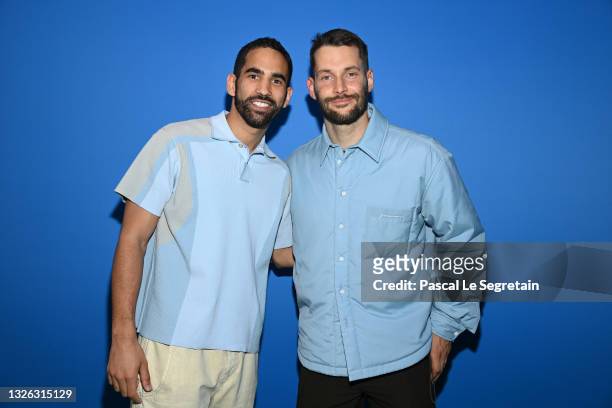Ouissem Belgacem and Simon Porte Jacquemus attend the photocall after the Jacquemus "La Montagne" show at La Cite Du Cinema on June 30, 2021 in...