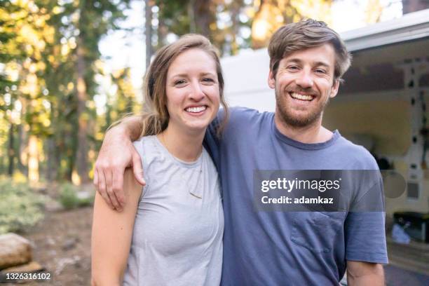 young couple van life in wilderness - testimonial stock pictures, royalty-free photos & images