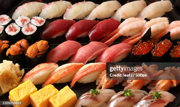 high angle view of seafood in plate,japan - sushi foto e immagini stock