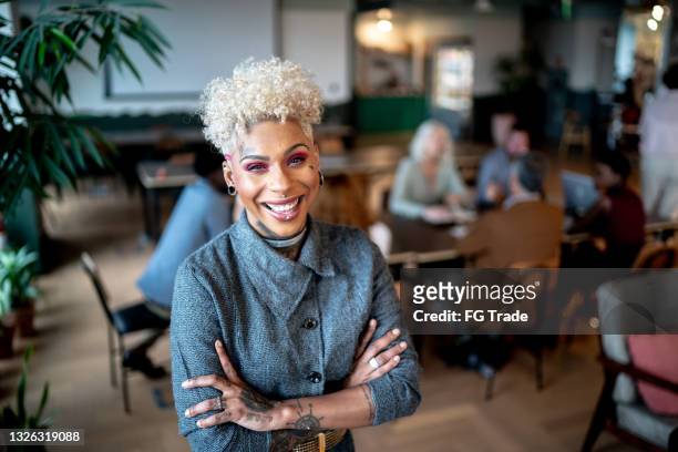 portrait of a businesswoman at work - gay person stockfoto's en -beelden