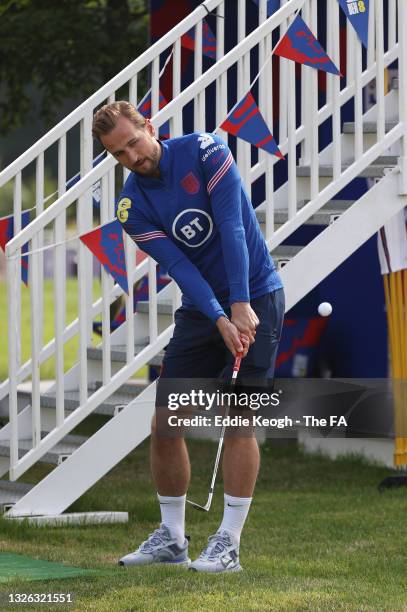 Harry Kane of England plays golf in the Lion's Den at St George's Park on June 30, 2021 in Burton upon Trent, England.