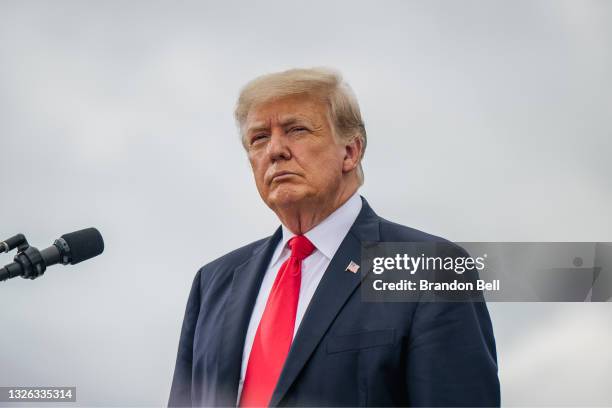 Former President Donald Trump looks on before speaking during a tour to an unfinished section of the border wall on June 30, 2021 in Pharr, Texas....