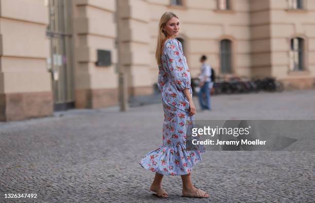 Carolin Niemczyk wearing LoveShackFancy flower midi dress and beige sandals on June 25, 2021 in Berlin, Germany.