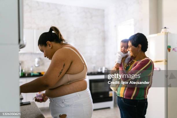 grandmother holding granddaughter - big fat white women stock pictures, royalty-free photos & images