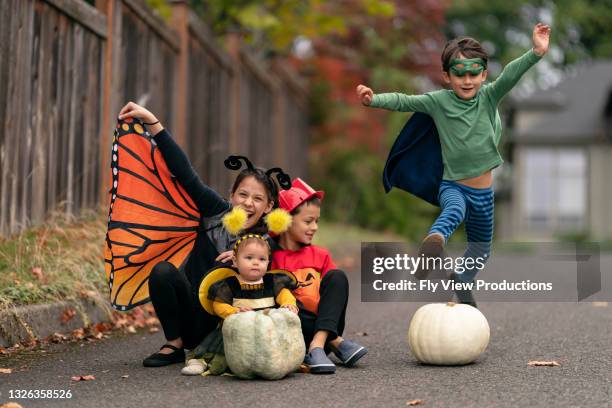 happy group of kids on halloween - baby superhero stock pictures, royalty-free photos & images