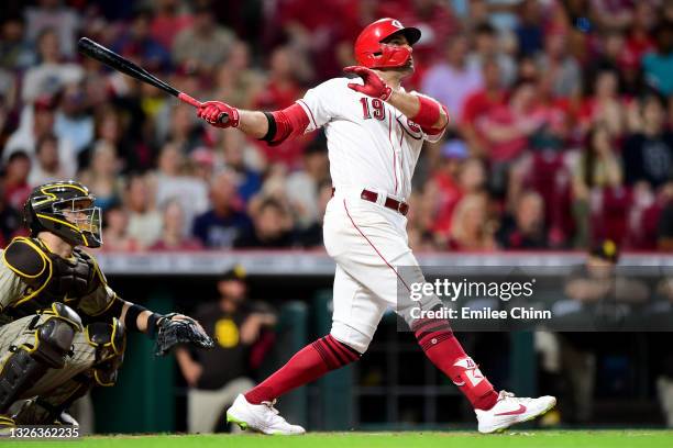 Joey Votto of the Cincinnati Reds hits a solo home run in the third inning for his 1000th career RBI during their game against the San Diego Padres...