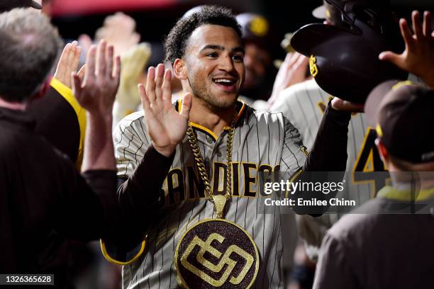 Trent Grisham of the San Diego Padres celebrates with teammates after hitting a grand slam in the fifth inning during their game against the...