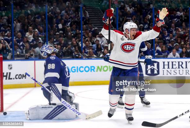 Tomas Tatar of the Montreal Canadiens celebrates after teammate Nick Suzuki , scored against Andrei Vasilevskiy of the Tampa Bay Lightning during the...