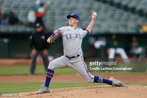 Kolby Allard of the Texas Rangers pitches in the bottom of the first inning against the Oakland Athletics at RingCentral Coliseum on June 30, 2021 in...