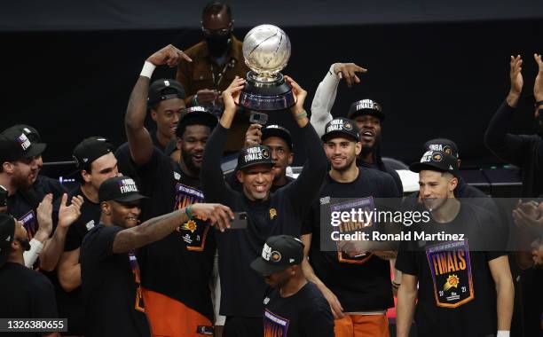 Head Coach Monty Williams of the Phoenix Suns holds the Western Conference Champion trophy after the Suns defeated the LA Clippers in Game Six of the...