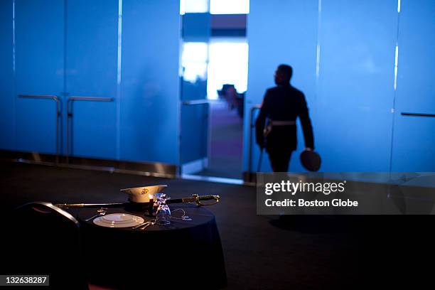 Marines in uniform passed by the Fallen Comrade Table during the luncheon. The table was meant to honor all the marines who have fallen in battle and...