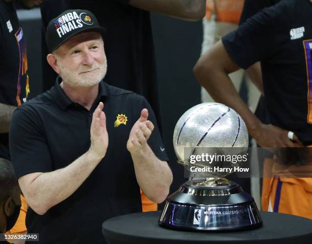 Owner Robert Sarver stands with the Western Conference Championship trophy after the Suns beat the LA Clippers to win the series in Game Six of the...