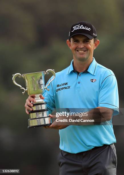 Greg Chalmers of Australia hold the trophy after winning the 2011 Emirates Australian Open at The Lakes Golf Club on November 13, 2011 in Sydney,...