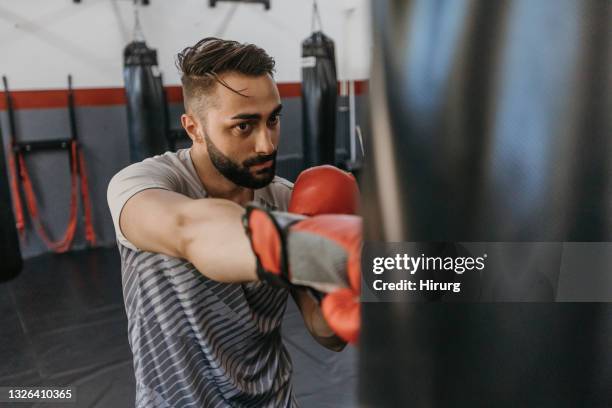 male boxer training in gym - boxboll bildbanksfoton och bilder