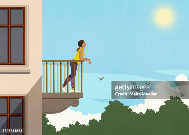 woman enjoying sunshine from apartment balcony - sonnig stock-grafiken, -clipart, -cartoons und -symbole