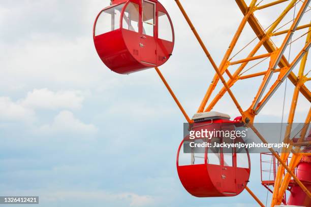 colorful ferris wheel against clear blue sky - kobe japan stock pictures, royalty-free photos & images