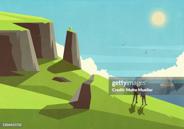 father and son backpacking on sunny green cliff overlooking ocean - hiking group stock-grafiken, -clipart, -cartoons und -symbole