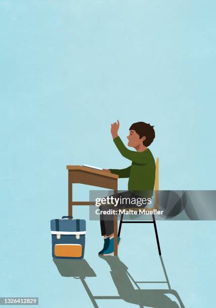 schoolboy raising hand at classroom desk - school boy with bag stock illustrations
