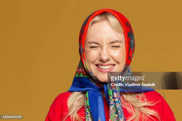 portrait carefree woman in colorful babushka headscarf - white silk stock pictures, royalty-free photos & images