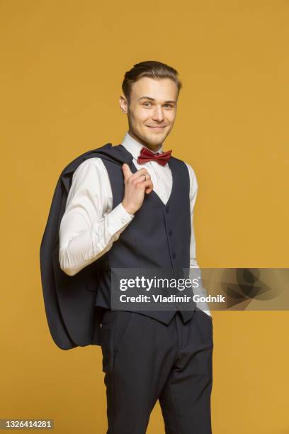 portrait confident, handsome young man in three piece suit - waistcoat stock pictures, royalty-free photos & images