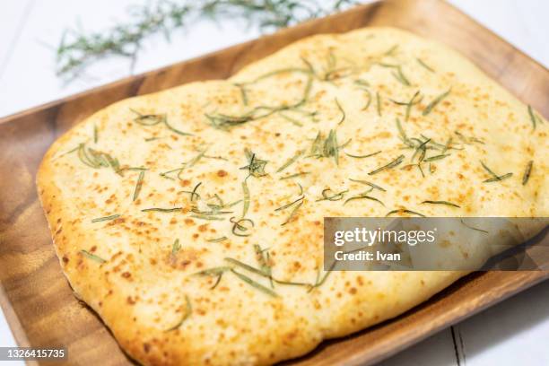 italian focaccia bread, homemade herbed focaccia bread with rosemary - fougasse photos et images de collection