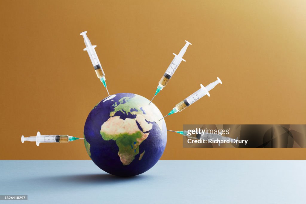 A world globe being vaccinated