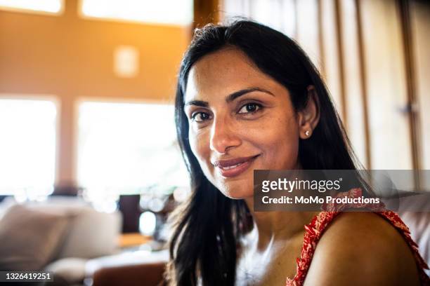 portrait of beautiful woman at home - serene people stock pictures, royalty-free photos & images