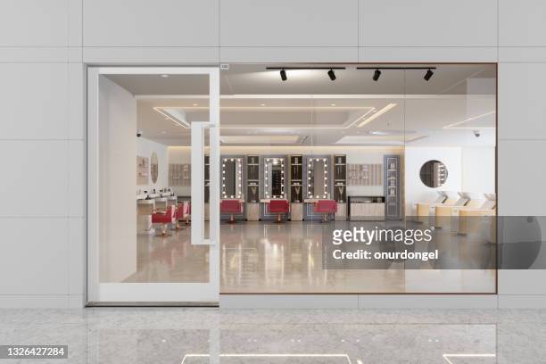 exterior of hairdressing and beauty salon with pink chairs, mirrors and tiled floor - store window stock pictures, royalty-free photos & images