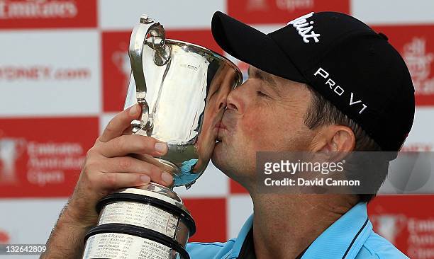 Greg Chalmers of Australia holds the trophy after winning the 2011 Emirates Australian Open at The Lakes Golf Club on November 13, 2011 in Sydney,...
