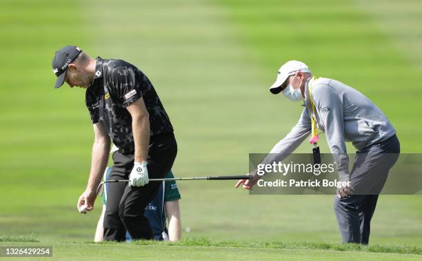 Stephen Gallacher of Scotland is given a ruling by a European Tour Rules Official during Day One of The Dubai Duty Free Irish Open at Mount Juliet...