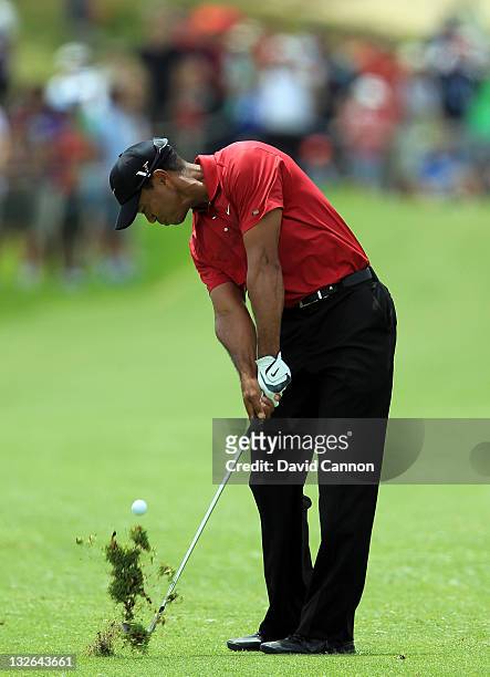Tiger Woods of the USA hits his second shot on the par 4, 1st hole during day four of the 2011 Emirates Australian Open at The Lakes Golf Club on...