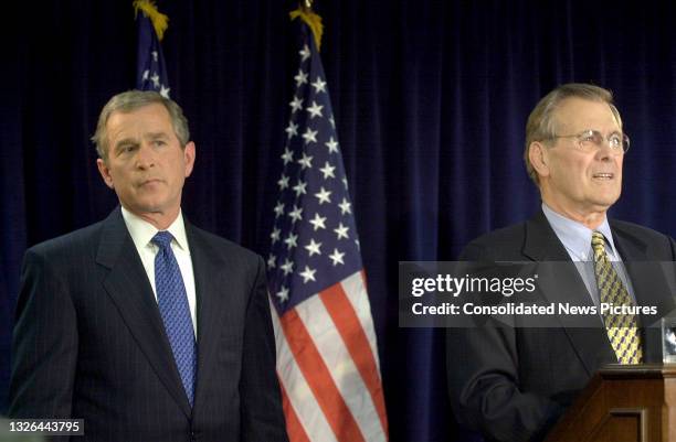 President-elect George W Bush listens following his nomination of Donald Rumsfeld as Secretary of Defense, Washington DC, December 28, 2000. Rumsfeld...