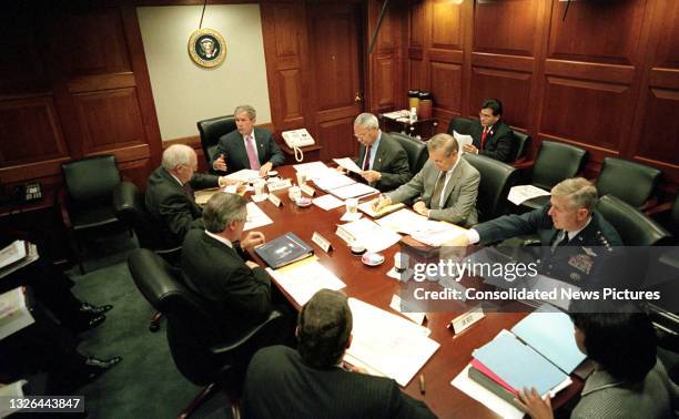 President George W Bush meets with members of the National Security Council meeting in the White House's Situation Room, Washington DC, October 12,...