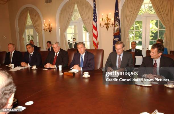 President George W Bush briefs members of Congress in the White House's Cabinet Room, Washington DC, September 12, 2001. They were discussing the...